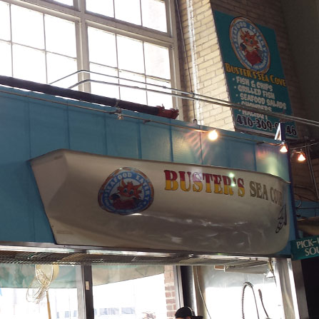 Sign installation in Buster's Sea Cove in Toronto, Ontario